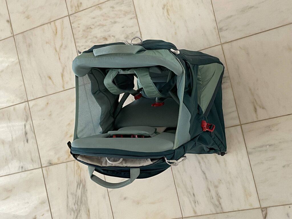 Higher up view of Osprey Poco LT child carrier and the fittings used to contain child. 