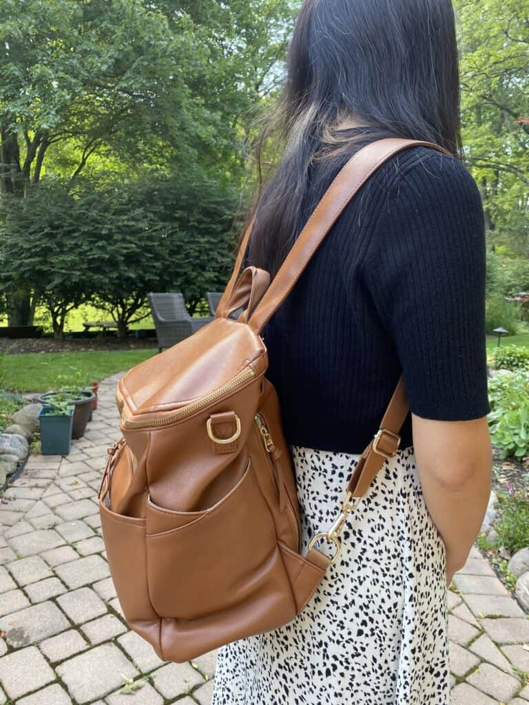 Side look of wearing Capri Diaper Bag 