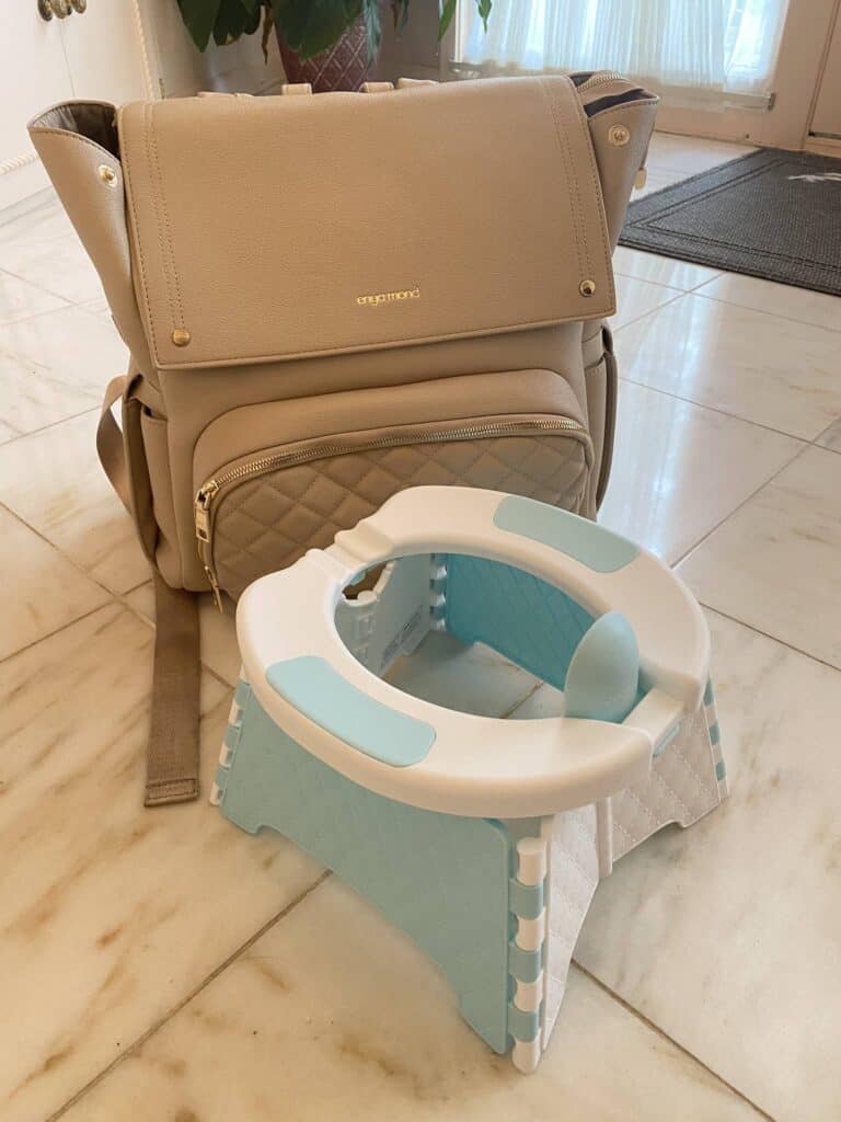 Jool Baby portable potty training chair unfolded compare to my diaper bag