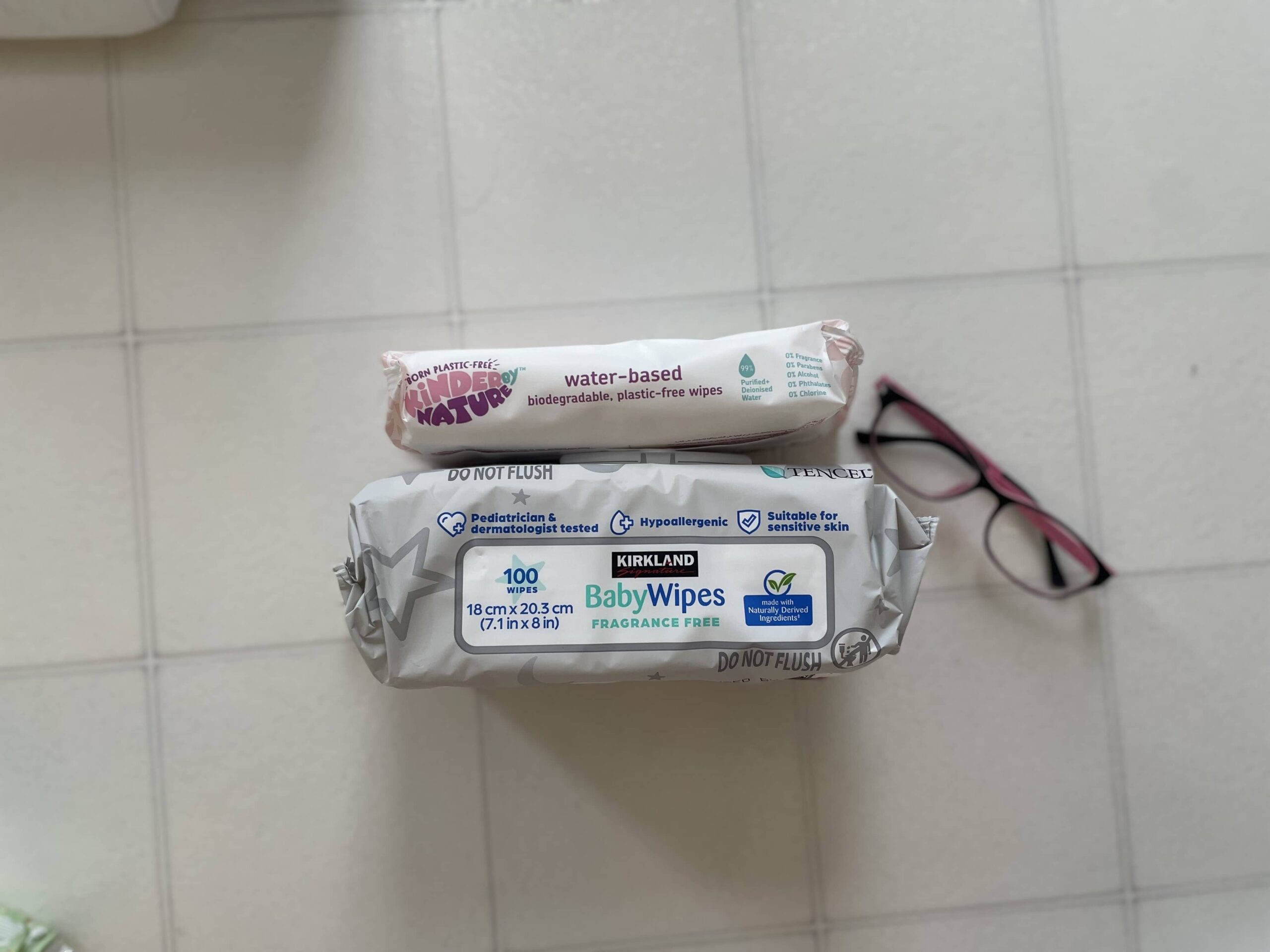 Image comparing Kirkland wipes packaging compared to other brands -- showcasing how large the Kirkland package is. 